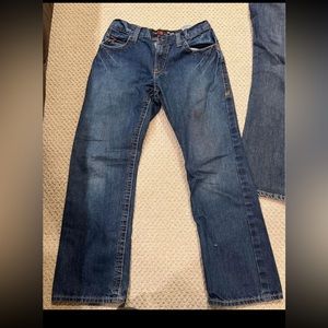 2 pairs Ariat FR jeans. One is low rise boot and the other is relaxed fit.